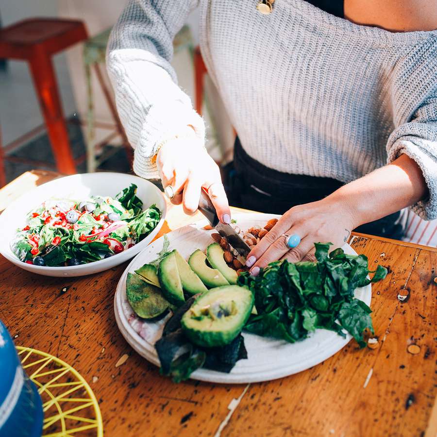 Woman preparing a fall salad